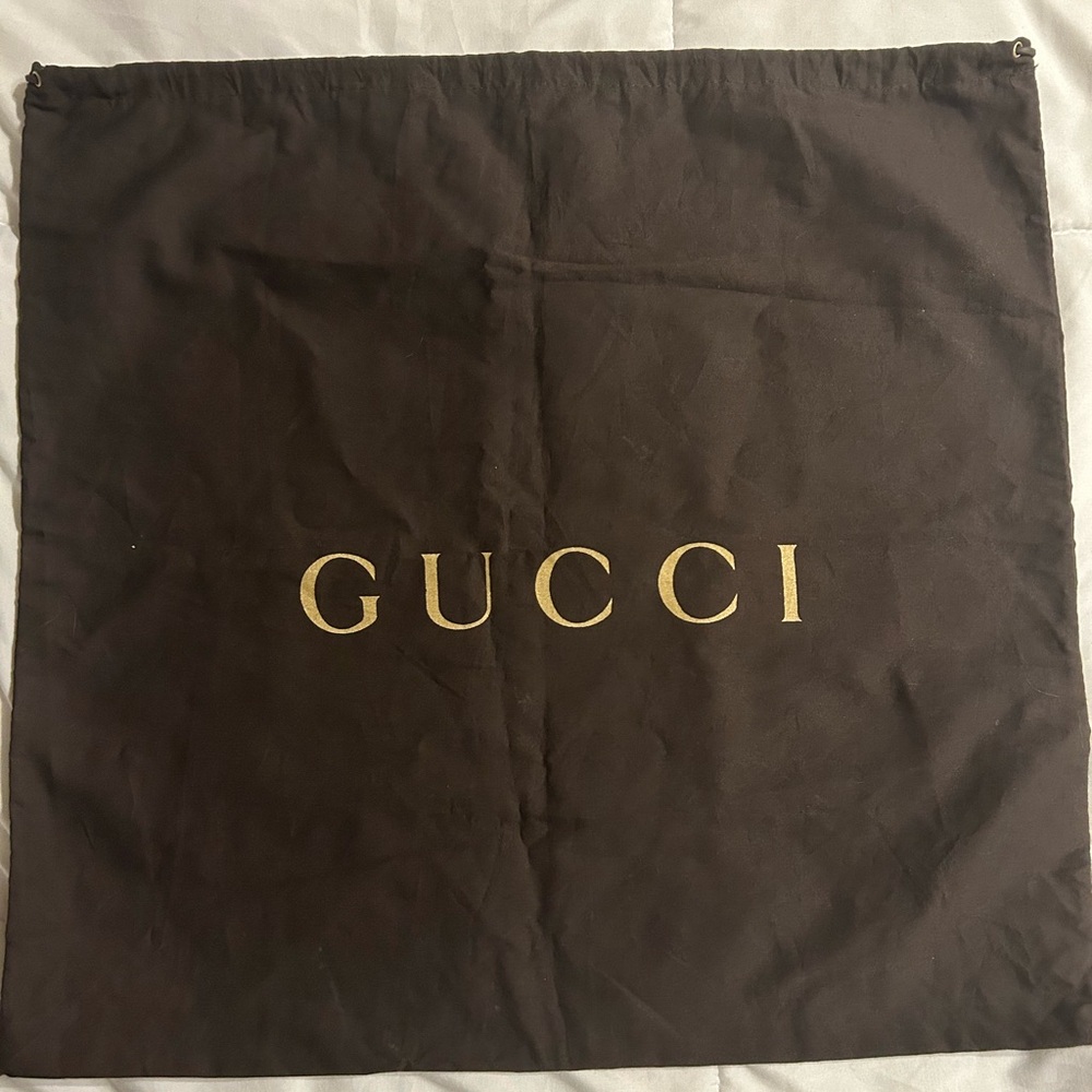 Authentic Gucci draw string dust bag, brown with gold lettering, 20” by 19”